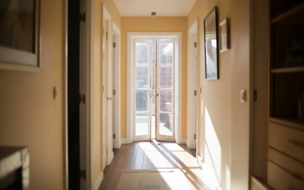 glass door narrow hallway light